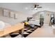 Large bedroom with bed, desk and ceiling fan at 7253 Seville Dr., Myrtle Beach, SC 29572