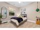 The decor includes ocean-themed art with an ocean view from the bedroom's window at 7253 Seville Dr., Myrtle Beach, SC 29572