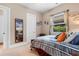 Comfortable bedroom featuring a cozy bed and a charming decorative surfing theme at 7253 Seville Dr., Myrtle Beach, SC 29572