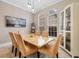Formal dining room showcases marble table, statement lighting, and neutral walls perfect for entertaining at 7253 Seville Dr., Myrtle Beach, SC 29572