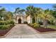 Charming home with a paved driveway and well-maintained landscaping at 7253 Seville Dr., Myrtle Beach, SC 29572