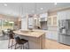 Modern kitchen featuring stainless steel appliances, a large island, and pendant lighting at 7253 Seville Dr., Myrtle Beach, SC 29572