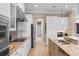 Modern kitchen with granite countertops, stainless appliances, custom cabinetry, and convenient breakfast bar at 7253 Seville Dr., Myrtle Beach, SC 29572