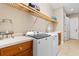 Bright laundry room complete with new washer and dryer and a sink at 7253 Seville Dr., Myrtle Beach, SC 29572