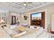 Stylish living room with a coffered ceiling, entertainment center and open entry way at 7253 Seville Dr., Myrtle Beach, SC 29572