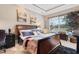 Serene bedroom features a large decorative bed, natural light and artwork adding a calm ambiance at 7253 Seville Dr., Myrtle Beach, SC 29572