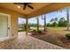 Back patio boasts stone pavers with views of lush green yard and lake at 7253 Seville Dr., Myrtle Beach, SC 29572
