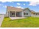 Picturesque backyard featuring a white fence and lush lawn, ideal for outdoor enjoyment at 739 Harrison Mill St., Myrtle Beach, SC 29579