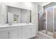 Bathroom with double vanity, walk-in shower, and a large mirror at 739 Harrison Mill St., Myrtle Beach, SC 29579