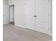 Neutral bedroom with a large closet featuring white doors, perfect for storage and organization at 739 Harrison Mill St., Myrtle Beach, SC 29579