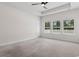 Bedroom featuring plush carpeting and windows offering views of the surrounding greenery at 739 Harrison Mill St., Myrtle Beach, SC 29579