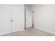 Bright bedroom features neutral carpet and large closet with white doors, perfect for storage at 739 Harrison Mill St., Myrtle Beach, SC 29579