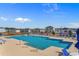 Community pool with lounge chairs, umbrellas, and clear blue water at 739 Harrison Mill St., Myrtle Beach, SC 29579