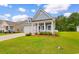 Charming home featuring a well-manicured lawn and inviting curb appeal with mature landscaping at 739 Harrison Mill St., Myrtle Beach, SC 29579