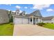 Inviting home showcasing double garage and manicured landscaping, creating curb appeal at 739 Harrison Mill St., Myrtle Beach, SC 29579