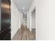 The long hallway has gorgeous wood floors and leads to rooms filled with natural light at 739 Harrison Mill St., Myrtle Beach, SC 29579