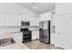 Well-lit kitchen showcases stainless steel appliances, granite counters, and white cabinetry at 739 Harrison Mill St., Myrtle Beach, SC 29579