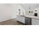 The kitchen features granite countertops, stainless steel appliances, and a view to the living room at 739 Harrison Mill St., Myrtle Beach, SC 29579