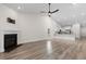 Bright living room with fireplace and open to a kitchen with white cabinets and stainless appliances at 739 Harrison Mill St., Myrtle Beach, SC 29579
