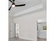 Spacious main bedroom with fan, en-suite bathroom, and tray ceilings at 739 Harrison Mill St., Myrtle Beach, SC 29579
