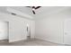 Spacious main bedroom with fan, tray ceilings, and doors to bathroom and closets at 739 Harrison Mill St., Myrtle Beach, SC 29579
