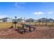 Community picnic area featuring a table and grill, perfect for outdoor gatherings at 739 Harrison Mill St., Myrtle Beach, SC 29579