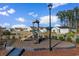 Community playground with a slide and climbing structure, fenced for safety at 739 Harrison Mill St., Myrtle Beach, SC 29579