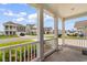 Charming porch view showcasing neighborhood homes and a well-maintained street at 739 Harrison Mill St., Myrtle Beach, SC 29579