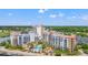 Scenic aerial view of resort featuring pools, spas, and multiple condo buildings surrounded by lush landscaping at 8121 Amalfi Pl. # 7-604, Myrtle Beach, SC 29572