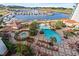 Expansive aerial view of the resort featuring a marina, pool, and lush landscaping at 8121 Amalfi Pl. # 7-604, Myrtle Beach, SC 29572