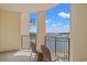 Charming balcony view of marina with two chairs under a beautiful sky at 8121 Amalfi Pl. # 7-604, Myrtle Beach, SC 29572