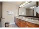 Bright bathroom featuring a double vanity with granite countertops and large framed mirror at 8121 Amalfi Pl. # 7-604, Myrtle Beach, SC 29572
