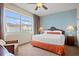 Inviting bedroom featuring a large window, comfortable seating, and a nightstand with a lamp at 8121 Amalfi Pl. # 7-604, Myrtle Beach, SC 29572