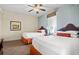 Bright bedroom featuring two beds, ceiling fan, and window with natural light at 8121 Amalfi Pl. # 7-604, Myrtle Beach, SC 29572