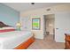 Serene bedroom featuring a spacious layout, a comfortable bed, and a view into the bathroom at 8121 Amalfi Pl. # 7-604, Myrtle Beach, SC 29572