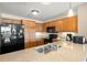 Well-appointed kitchen boasts wooden cabinetry, stainless steel appliances, and granite countertops for stylish cooking at 8121 Amalfi Pl. # 7-604, Myrtle Beach, SC 29572