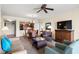 Open-concept living space with dining area, kitchen view, comfortable seating, and entertainment center at 8121 Amalfi Pl. # 7-604, Myrtle Beach, SC 29572