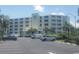 Condo exterior with parking lot and neatly landscaped grounds showcasing beachside living at 9400 Shore Dr. # 507, Myrtle Beach, SC 29572