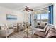 Living room showing stylish décor, ceiling fan and balcony with a view of the water at 9400 Shore Dr. # 507, Myrtle Beach, SC 29572