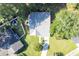 Overhead view of the property with its metal roof, landscaping, and surrounding trees at 9664 Middleton Ct., Murrells Inlet, SC 29576