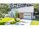 Charming single-story home featuring a brick facade, metal roof, and well-manicured lawn at 9664 Middleton Ct., Murrells Inlet, SC 29576