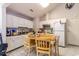 Functional kitchen featuring white cabinets and a cozy eat-in dining area at 9664 Middleton Ct., Murrells Inlet, SC 29576