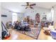 Spacious living room with ceiling fan, hardwood floors, and ample natural light at 9664 Middleton Ct., Murrells Inlet, SC 29576