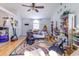 Bright living area featuring hardwood floors, ceiling fan and large sunny window at 9664 Middleton Ct., Murrells Inlet, SC 29576