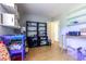 Storage room featuring open shelving, laminate floors, and a door leading to another area at 9664 Middleton Ct., Murrells Inlet, SC 29576