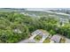 Aerial view of a beautiful home surrounded by lush greenery and serene waterways at 1009 Oak Marsh Ln., North Myrtle Beach, SC 29582