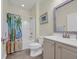 Bright bathroom features neutral color, shower-tub combo and single sink vanity at 1009 Oak Marsh Ln., North Myrtle Beach, SC 29582