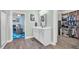 Bathroom with vanity and tiled floor provides access to office and walk-in closet at 1009 Oak Marsh Ln., North Myrtle Beach, SC 29582