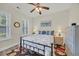 Charming bedroom with ceiling fan, blue and white accents, and a cozy bed at 1009 Oak Marsh Ln., North Myrtle Beach, SC 29582