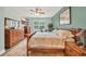 Bedroom with wooden furniture, neutral bedding, and a TV for added comfort at 1009 Oak Marsh Ln., North Myrtle Beach, SC 29582